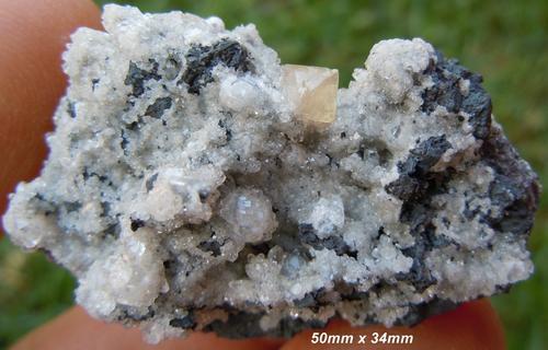 Kalahari manganese fields olmiite and calcite crystals on matrix-south africa.jpg