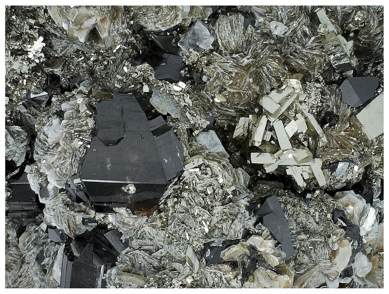 03 - CASSITERITE WITH PYRITE ON QUARTZ.jpg