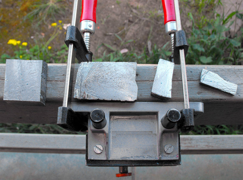 CUTTING BY HAND A YTTRIUM BLOCK 2.jpg.jpg