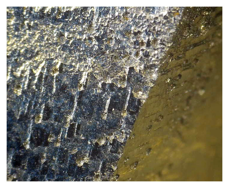 Elba Pyrite with Hematite - pyrite face boundary.jpg